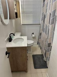 a small bathroom with a sink and a toilet at Bourbon Belle of Bardstown in Bardstown +18 photos