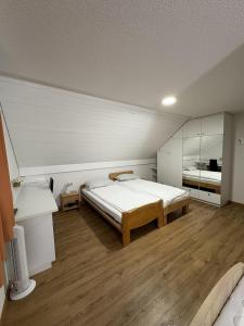 En eller flere senge i et værelse på Landgasthof zum Zimmermann