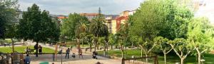 a park with trees and people walking in a park at O lar da luz in Ourense