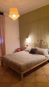 En eller flere senge i et værelse på LaelleApartament Rho Fiera San Siro