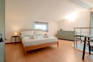 a bedroom with a bed and a bunk bed at Trieste - Villa Prosecco in Prosecco +59 photos