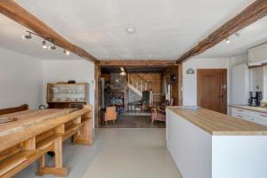 a kitchen with a wooden counter top in a room at Le Chalet Rustique in Spa