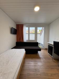 En eller flere senge i et værelse på Landgasthof zum Zimmermann