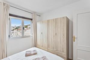 a bedroom with a bed and a window at Villa Star in Agaete
