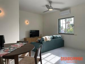 a living room with a couch and a table at Casa di Campara Almada Villa in FAO