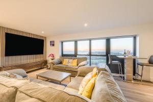 a living room with a couch and a flat screen tv at 2 Bed in Tintagel oc-g33170 in Tintagel