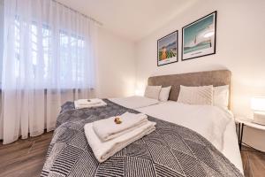 En eller flere senge i et værelse på The R Apartment Farnsberg