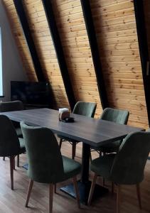 a conference room with a table and chairs at A frame abdul in Quba
