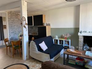 a living room with a couch and a table at Maison idéale pour visiter Bordeaux in Ambarès-et-Lagrave +27 photos