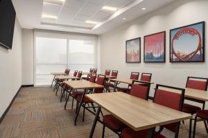 a dining room with wooden tables and chairs at Home2 Suites By Hilton Vaughan Toronto On in Vaughan +32 photos