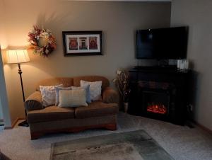 a living room with a couch and a fire place at Poplar Estate in Lincoln