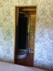 a mirror on the wall of a room at Camping Les Rochelles in Prunay-Cassereau