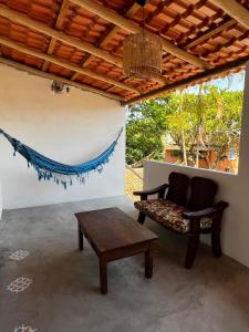 a living room with a couch and a table at Casa Cris in Itaúnas +20 photos