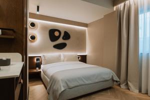 En eller flere senge i et værelse på Hotel Trianon