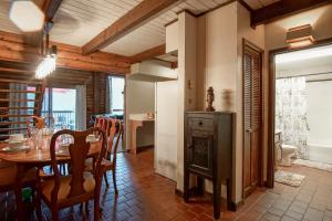 a dining room with a table and a fireplace at 2 Br Plus Loft: Hawthorne Valley 4 in Snowshoe