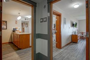 a hallway of a home with a kitchen and a living room at Rimfire 151- 152 Unique 2 Br Condo in Snowshoe