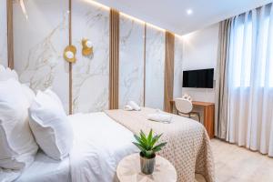 En eller flere senge i et værelse på Garbo Hôtel + 32 billeder