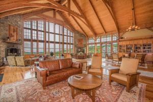 a living room with a couch and a table at Soaring Eagle 414 in Snowshoe
