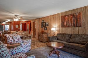 a living room with a couch and a table at Powderidge 2 -Slope Side, Spacious Deck in Snowshoe