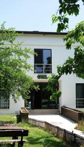 a white building with a sign that reads gut at The Life Nest Hotel in Saray