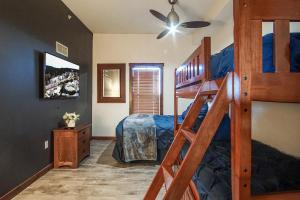 a bedroom with a bunk bed with a ladder at Soaring Eagle #403: 2 Bedrooms, 2 Full Baths in Snowshoe +29 photos
