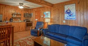 a living room with a blue couch and a kitchen at Stemwinder 6B 1 Bedroom, 1 Full Bath, Slope Side in Slaty Fork