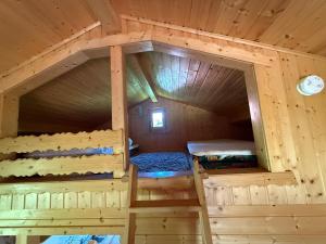 an inside view of a cabin with two bunk beds at Eulennest in Reimershagen
