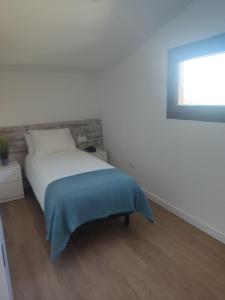 En eller flere senge i et værelse på La Caseta del Ter