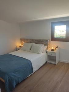 En eller flere senge i et værelse på La Caseta del Ter