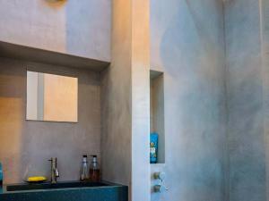 a bathroom with a sink and a mirror at Bredy Cottages in Bridport +44 photos