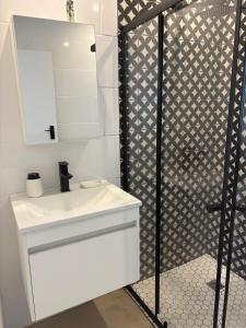 a bathroom with a white sink and a mirror at Providence in Hermanus +48 photos