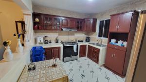 Kuchyň nebo kuchyňský kout v ubytování Descansa sin prisas a minutos del Aeropuerto + 9 fotografií