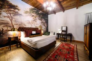 a bedroom with a bed and a painting on the wall at Webersburg in Stellenbosch +154 photos