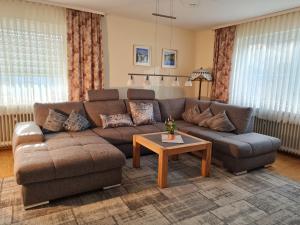 a living room with a couch and a coffee table at Ferienwohnung Schabmüller in Kelheim