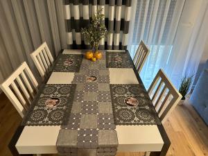 a dining room table with a chess board on it at Berlińska 43 in Jelenia Góra