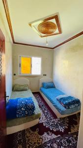 Giường trong phòng chung tại Adrar N Darn Guesthouse