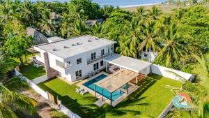 an aerial view of a white house with a swimming pool at Villa Moka 2 in Taxisco