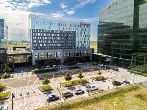 an aerial view of a parking lot in front of buildings at Courtyard by Marriott Montreal Brossard in Brossard