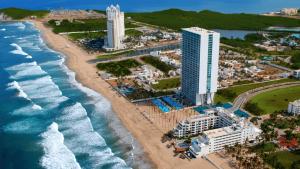 an aerial view of a beach and the ocean at Condo de lujo en Mazatlan Peninsula in Mazatlán