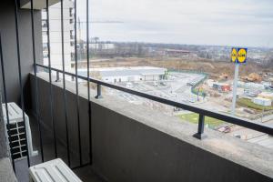 a balcony of a building with a view of a highway at Royal Blue Iasi in Iaşi