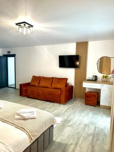 TV a/nebo společenská místnost v ubytování Casa de Vacanta Magherus + 129 fotografií