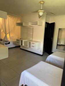 En eller flere senge i et værelse på Pousada Recanto da Mata