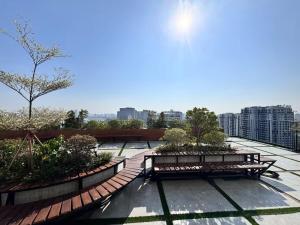 two benches sitting on top of a roof at Solari 15F Duplex Suite with Nhat Tan Bridge View in Hanoi