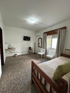 En eller flere senge i et værelse på El Nido FM