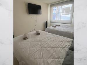 Giường trong phòng chung tại Hospedaje Gladys +13 ảnh