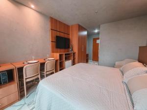 En eller flere senge i et værelse på Flat Comfort Taguatinga - Cama King - Sauna, academia e Piscina - Propriedade Particular 508 + 14 billeder