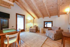 a large living room with a table and chairs at Albergo Locanda Mezzosoldo in Mortaso