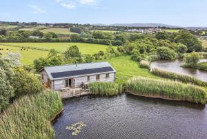 an aerial view of a house on a river at 3 Bed in Shebbear oc-l32582 in Shebbear
