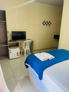 Giường trong phòng chung tại Pousada Reflexo das Águas