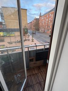 a balcony with a view of a city street at 120 m2 newly renovated apartment in Copenhagen +3 photos